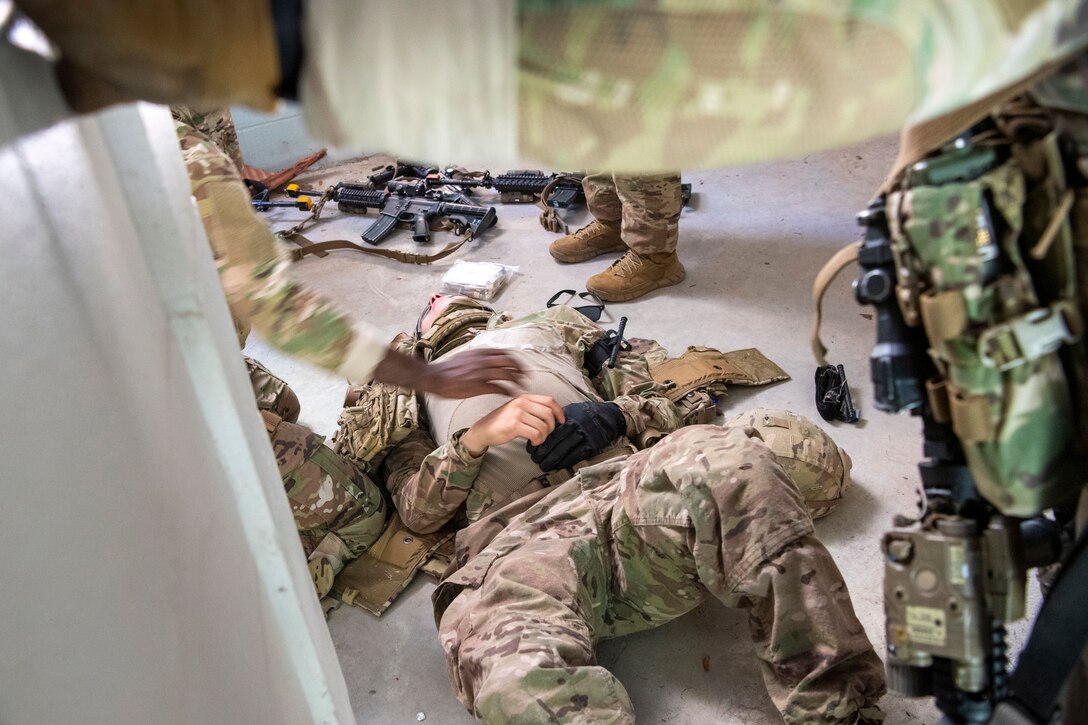 An Airman acts as a casualty during a training scenario