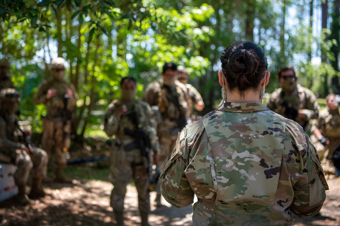 Airmen debrief after a training scenario