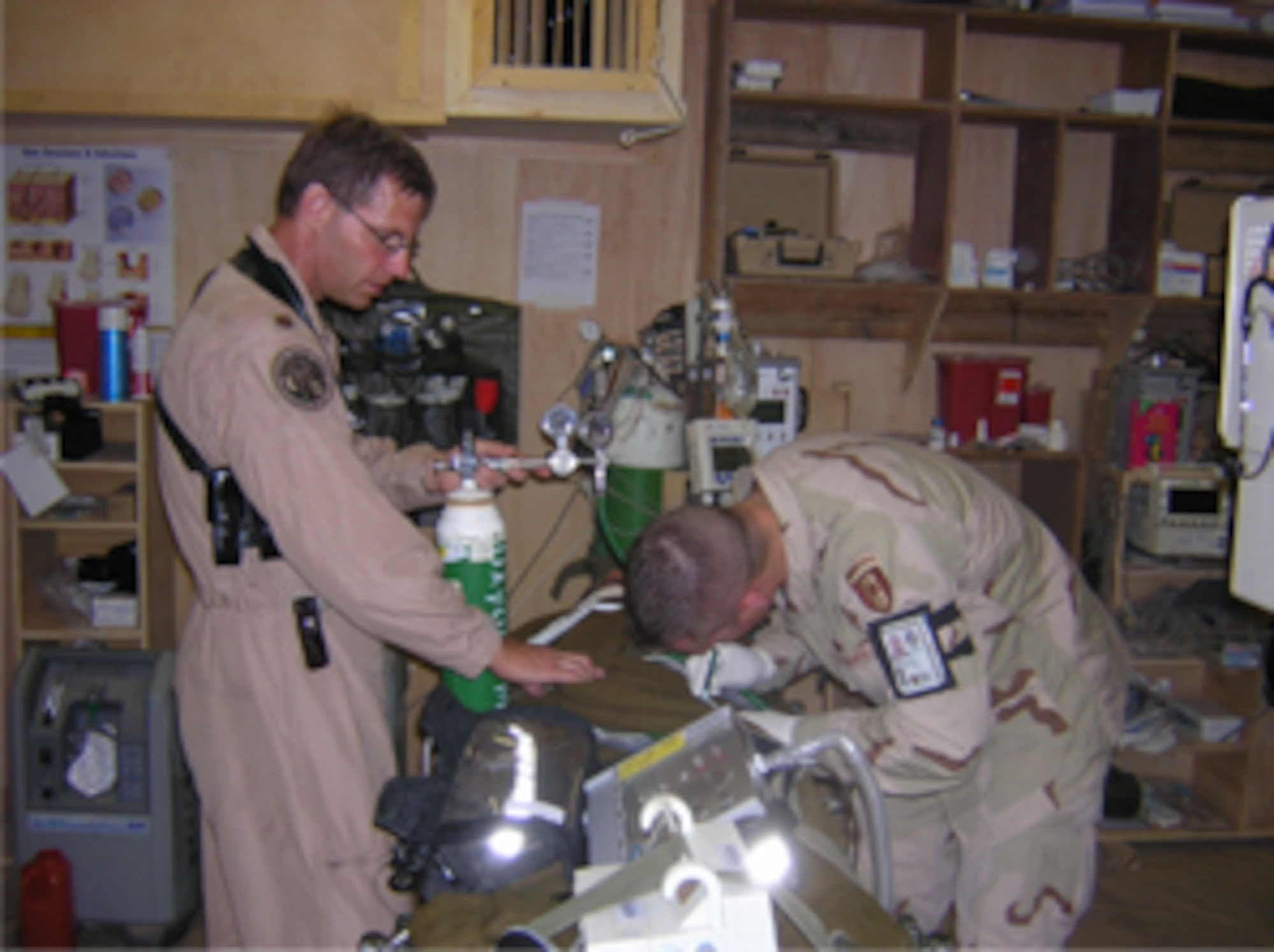 Maj Robert McCoy, left, works on CCATT equipment.