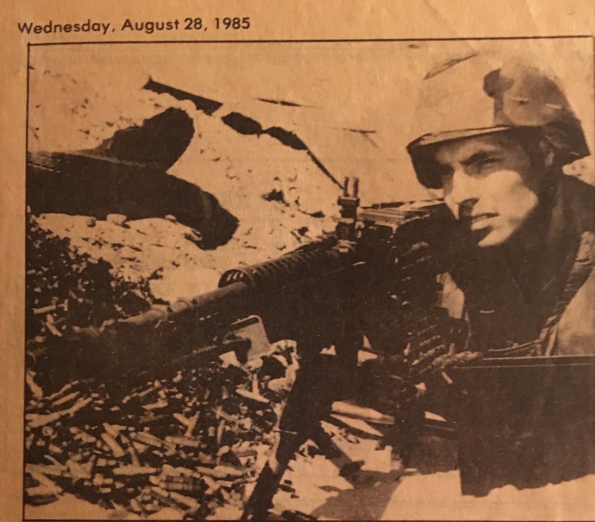 A Marine holds a rifle