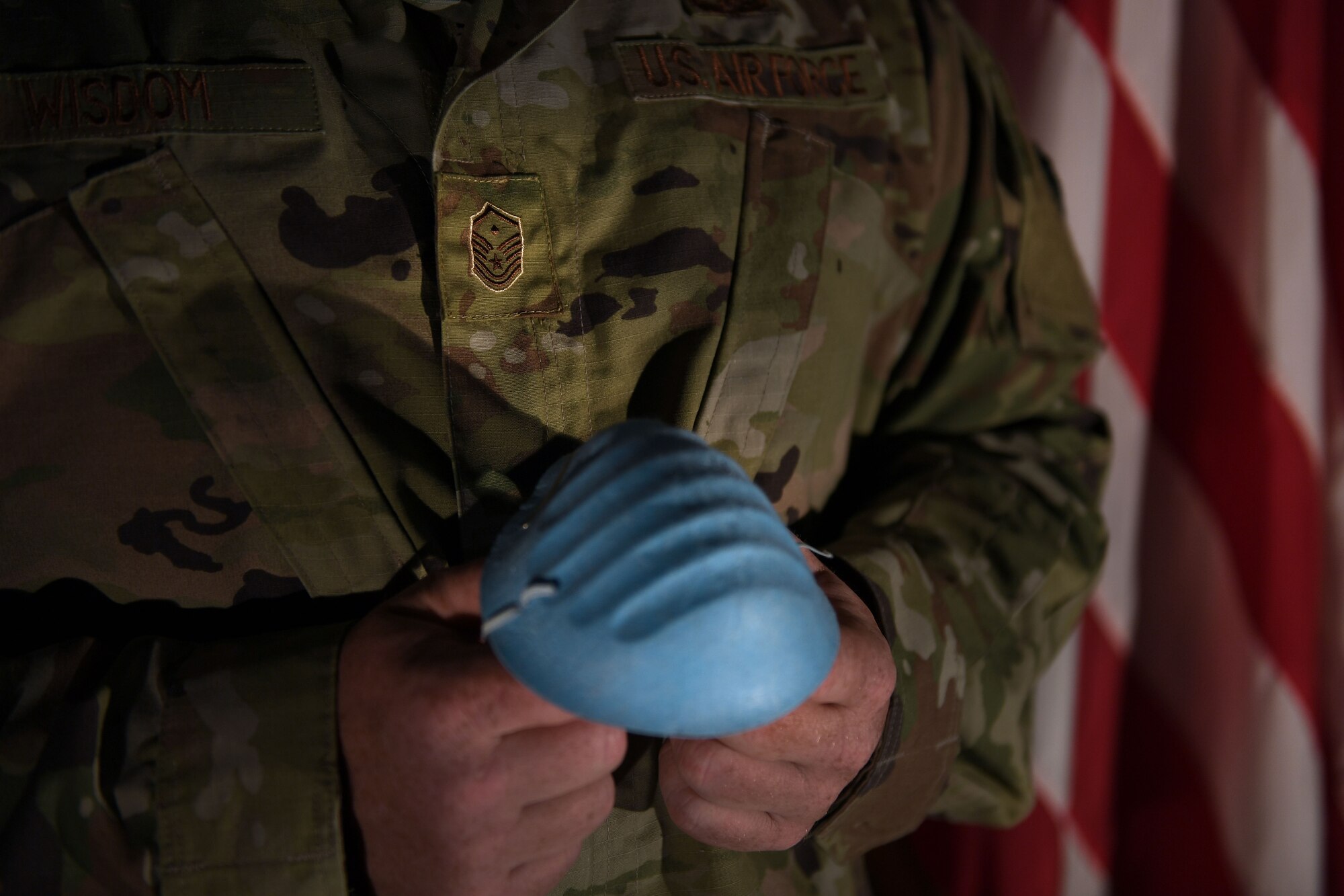 first sergeant holds mask