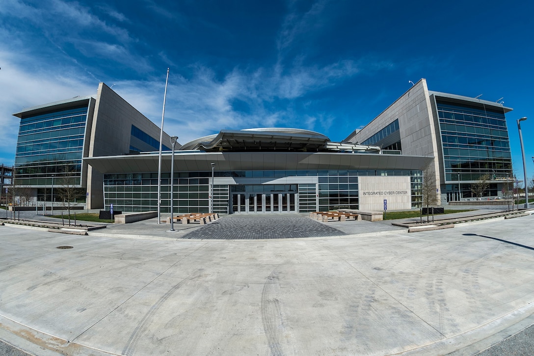 The words “Integrated Cyber Center” identify  a large, modern building.