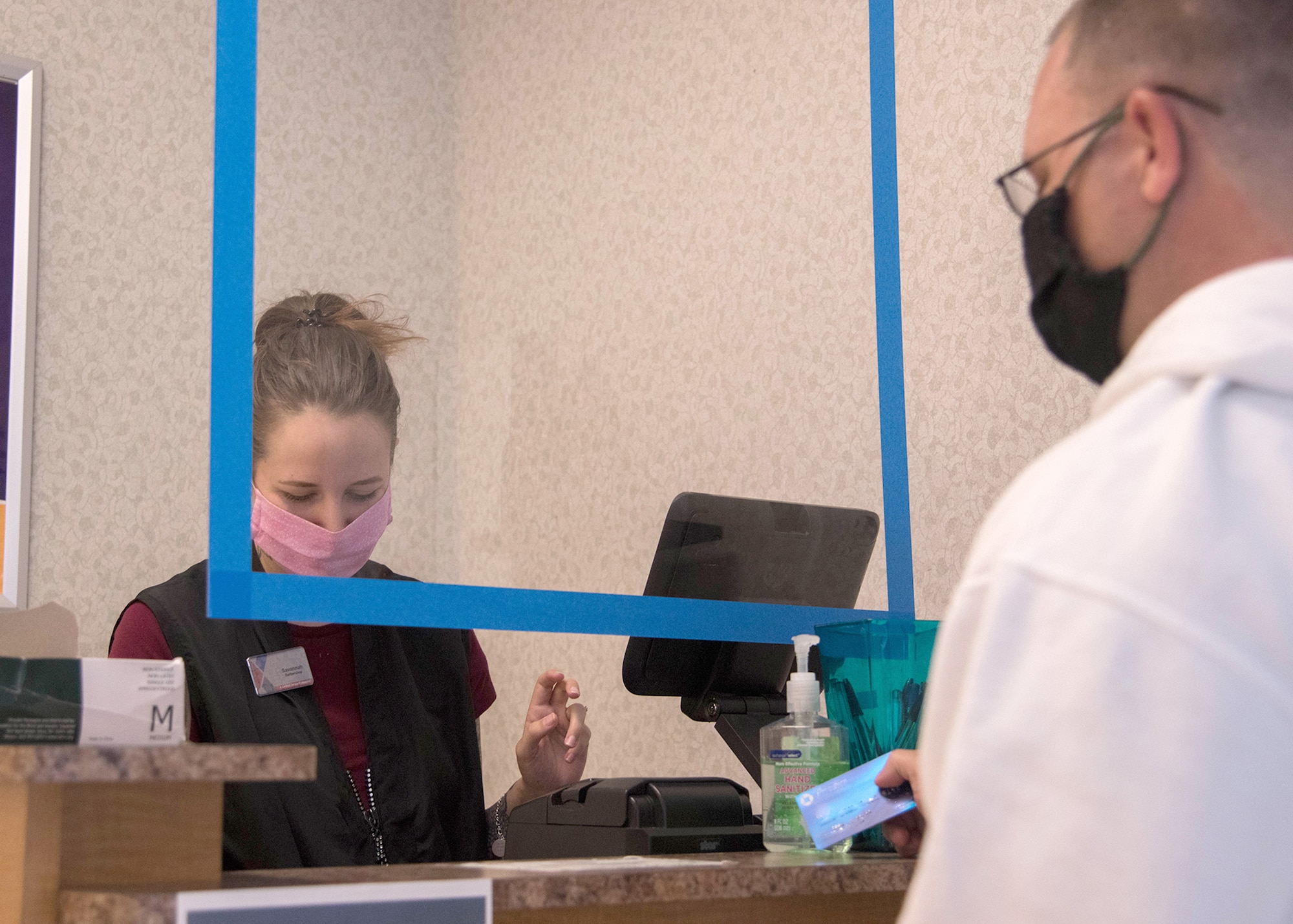 Savannah Rahm, Base Exchange barbershop
manager, receives payment from Tech. Sgt. Jason
Clinch, 373rd Training Squadron, May 19, 2020,
at Dover Air Force Base, Delaware. The
barbershop is currently only accepting credit or
debit cards to minimize cash handling at the
register. (U.S. Air Force photo illustration by
Airman 1st Class Faith Schaefer) (This photo has been altered for security purposes)