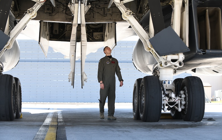 An aviator assigned to the 34th Bomb Squadron at Ellsworth Air Force Base, S.D., conducts pre-flight checks on a B-1B Lancer prior to launching in support of a Bomber Task Force mission in the U.S. European Command area of responsibility May 19, 2020. BTF missions are representative of the U.S. commitment to integrate with NATO and allied partners to ensure regional security. (U.S. Air Force photo by Airman 1st Class Christina Bennett)