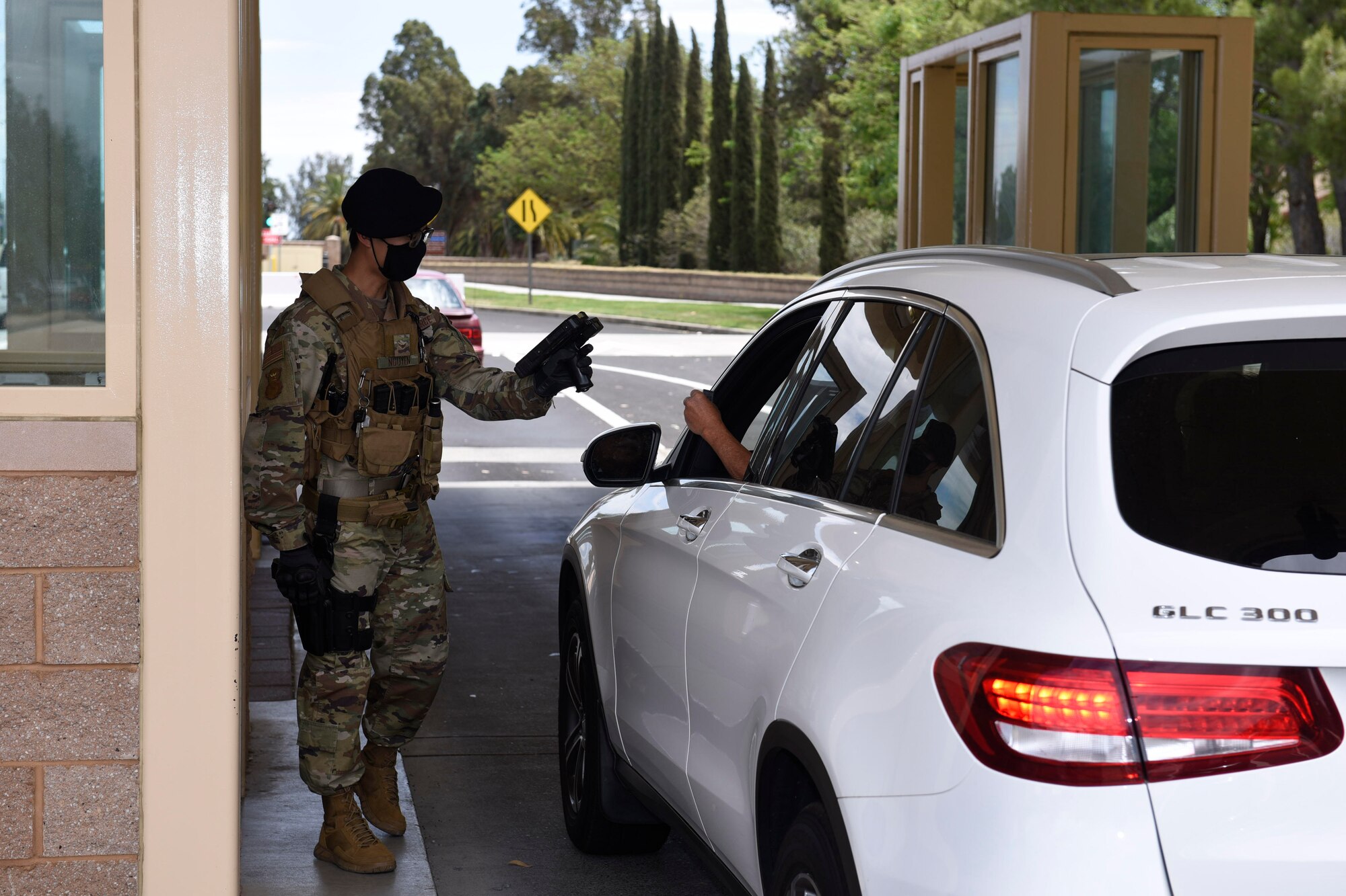 U.S. Airman 1st Class Jason Nguyen, 60th Security Forces Squadron entry controller, scans an identification card May 11, 2020, at Travis Air Force Base, California. Security forces Airmen at Travis AFB protect thousands of people and essential resources for three wings. (U.S. Air Force photo by Airman 1st Class Cameron Otte)