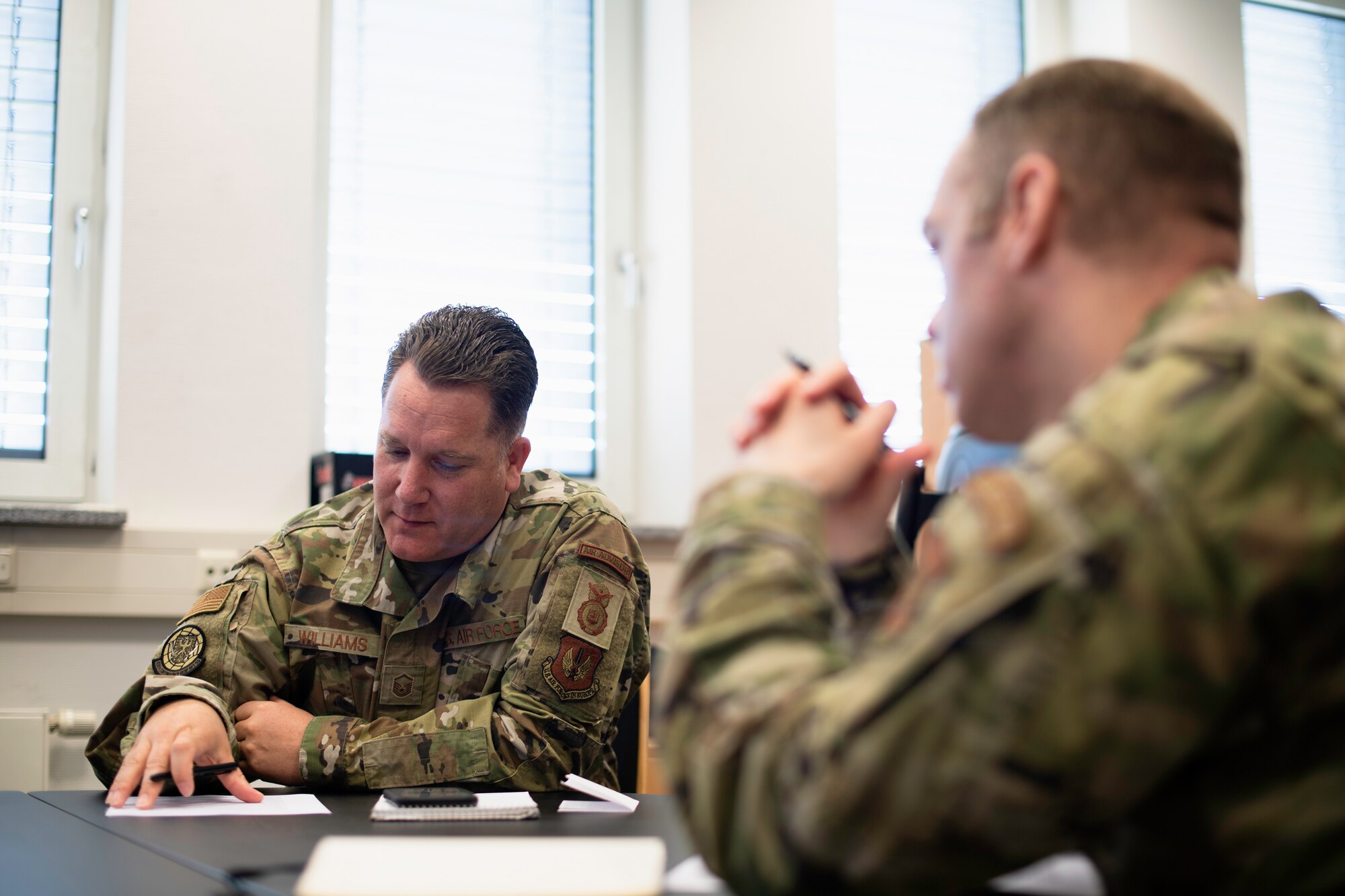 Photo of air advisors attending a video conference