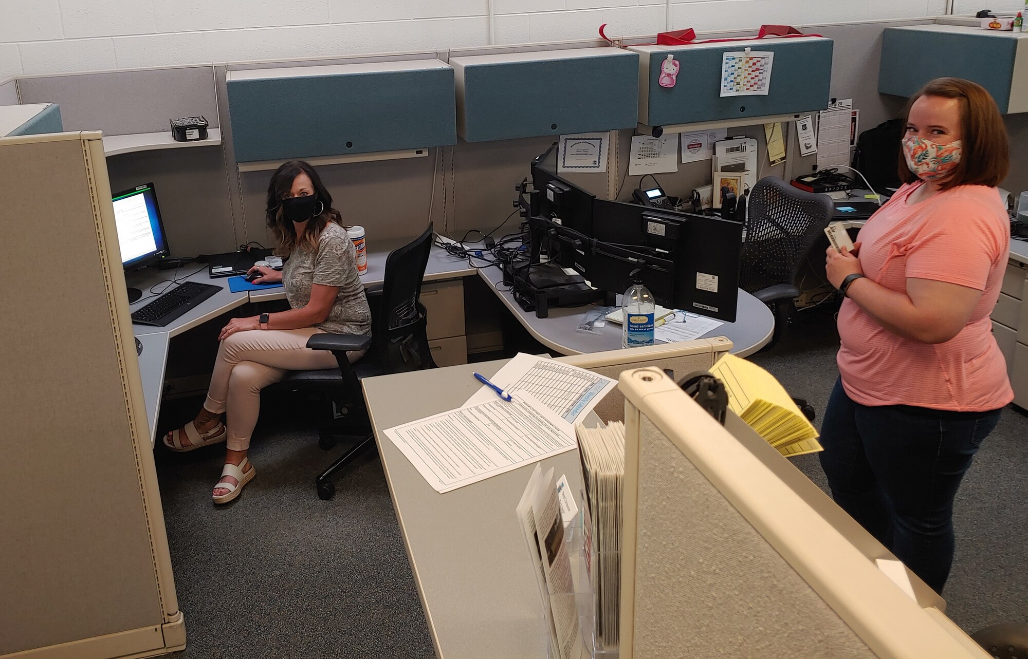 Lisa Smith, Group Facilities/Safety Program manager; Audits Program manager,  with the 748th Supply Chain Management Squadron at Hill Air Force Base, Utah, performs a CAC reset for Jessica Brown.