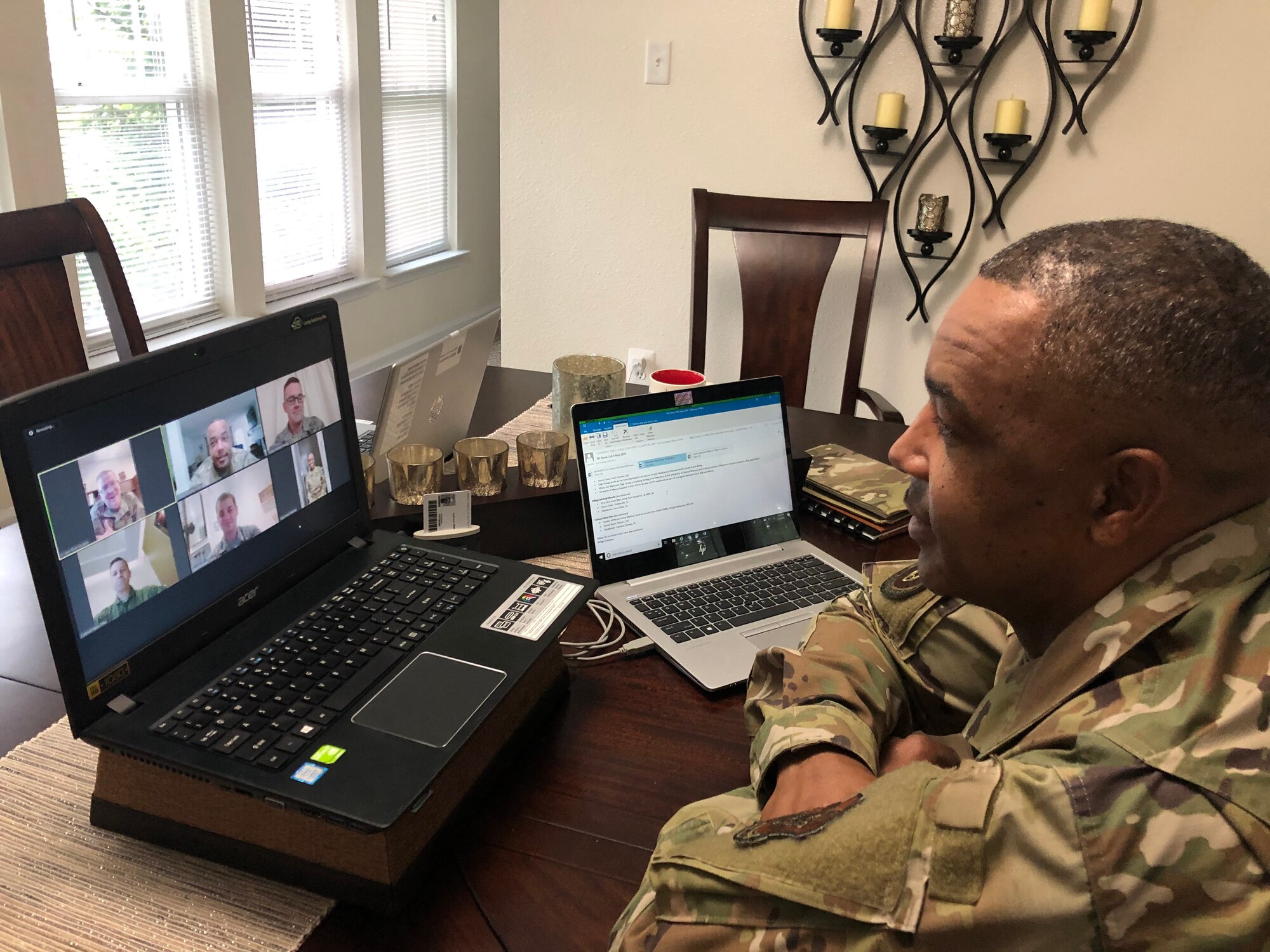 Chief Master Sgt. Timothy White keeps in touch with a few of his fellow Reserve Citizen Airmen via teleconference while teleworking from home during the COVID-19 pandemic. (Senior Master Sgt. Kori Conaway)