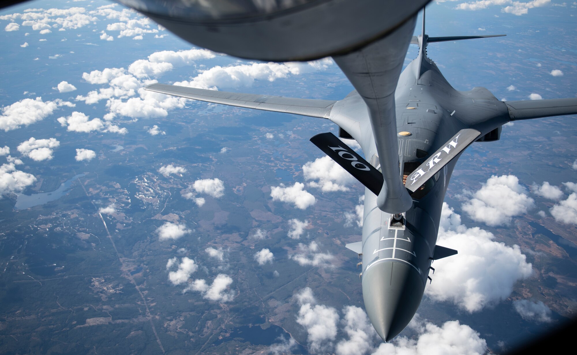A B-1B Lancer from the 28th Bomb Wing, Ellsworth Air Force Base, South Dakota, receives fuel from a KC-135 Stratotanker from the 100th Air Refueling Wing, RAF Mildenhall, England, during a Bomber Task Force Europe mission over Sweden, May 20, 2020. The mission marked the first time B-1s have flown over Sweden to integrate with Swedish Gripens while conducting close-air support training with Swedish Joint Terminal Attack Controller ground teams at Vidsel Range. (U.S. Air Force photo by Tech. Sgt. Emerson Nuñez)