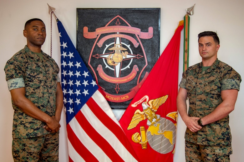 U.S. Marine Corps Staff Sgt. Hubert Robertson, left, S-3 assistant training chief and Sgt. Christopher Whitby, right, watch chief with Provost Marshal Office, both with Headquarters and Support Battalion, Marine Corps Installations East-Marine Corps Base Camp Lejeune, pose for a photo at building 8 on Marine Corps Base Camp Lejeune, North Carolina, May 13, 2020. Robertson and Whitby collaborated together and presented a new digital classroom for Marines attending Lance Corporals Leadership and Ethics Seminar. (U. S. Marine Corps photo by Cpl. Karina Lopezmata)