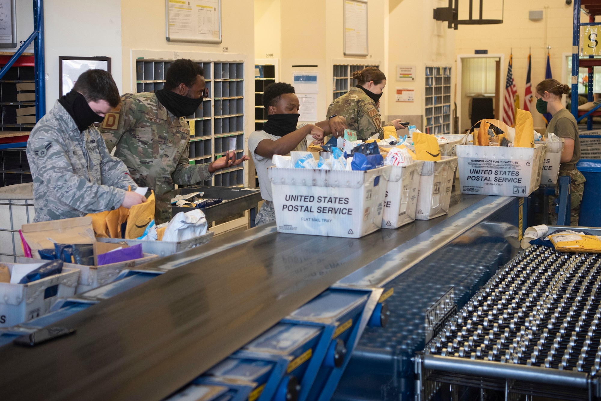 Postal clerk Airmen inventory packages at the post office at RAF Mildenhall, England, May 19, 2020. Newly arrived packages are in-processed to ensure accountability of mail and alert customers to when their order has arrived. (U.S. Air Force photo by Airman 1st Class Joseph Barron)