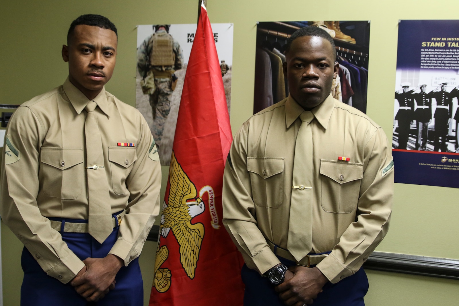 Montgomery natives Pfc. Adarious Gibbs and Lance Cpl. Isaiah Walker-Trammell pose for a photo in RSS Montgomery's recruiting office. Gibbs and Walker-Trammell will spend their time home assisting recruiters during the holidays.