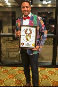 Master Sgt. Walter Warren holds his award as he was inducted into the 6th Marine Corps District's Hall of Fame. Master Sgt. Warren spent the majority of his Marine Corps career serving the people of the 6th district.