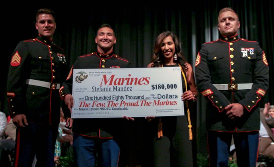Stephanie Mandez, a Cairo High School student, is presented a Navy Reserves Officer Training Corps Scholarship at Cairo High School Senior's Awards Night, April 29, 2019, at Cairo High School in Cairo, Georgia. Mandez is one of eight applicants to receive this scholarship in RS Jacksonville’s area of operation. (U.S. Marine Corps Photo by Cpl. Mike Hernandez)