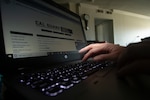 A California National Guard full-time technician works from home May 20, 2020, at Huntington Beach, California. Many Cal Guard full-time staff members are teleworking during the COVID-19 pandemic as a way of protecting themselves, their coworkers and high-risk family members from the virus.