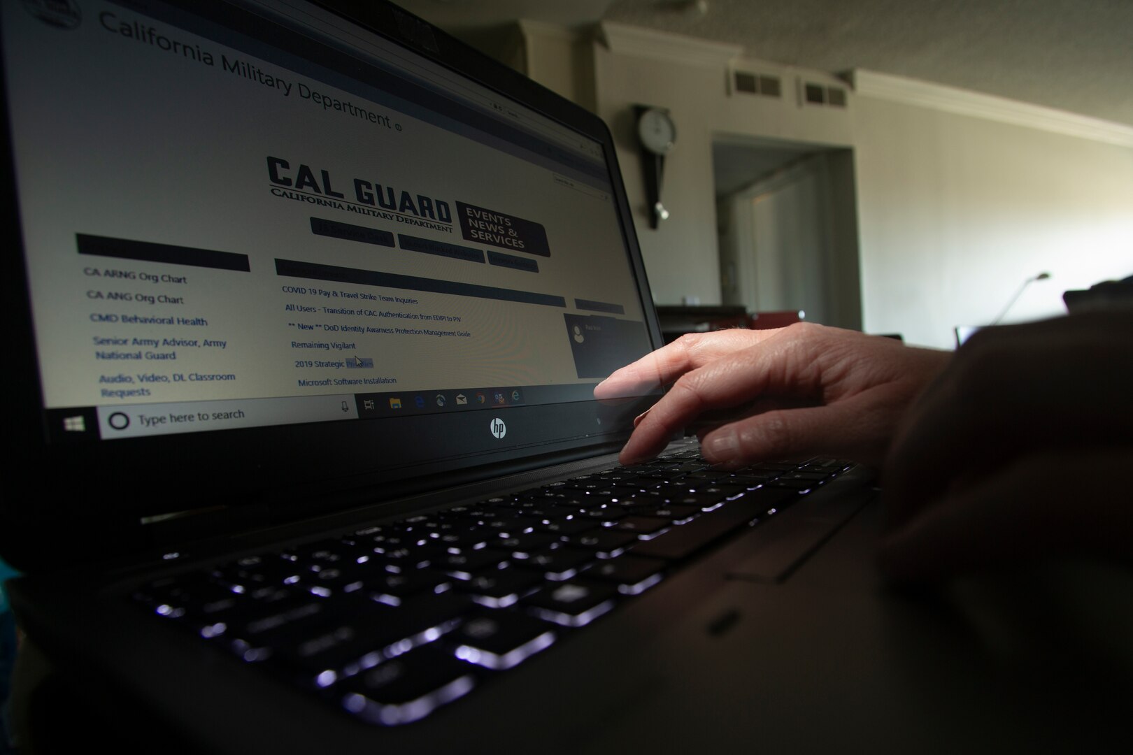 A California National Guard full-time technician works from home May 20, 2020, at Huntington Beach, California. Many Cal Guard full-time staff members are teleworking during the COVID-19 pandemic as a way of protecting themselves, their coworkers and high-risk family members from the virus.