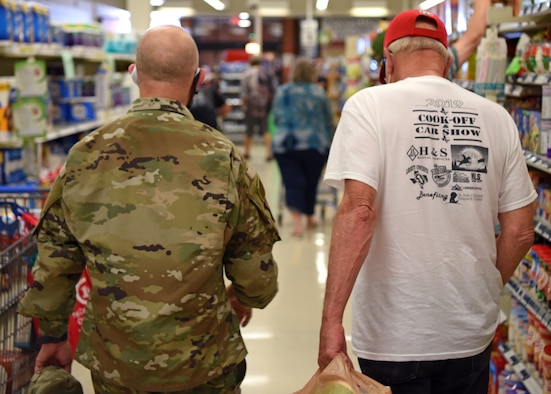 U.S. Air Force Col. Andres Nazario, 17th Training Wing commander, talks with a retiree on Goodfellow Air Force Base, Texas, May 20, 2020. Nazario reminded retirees that face coverings must be worn at all times while on Goodfellow. (U.S. Air Force photo by Airman 1st Class Ethan Sherwood)