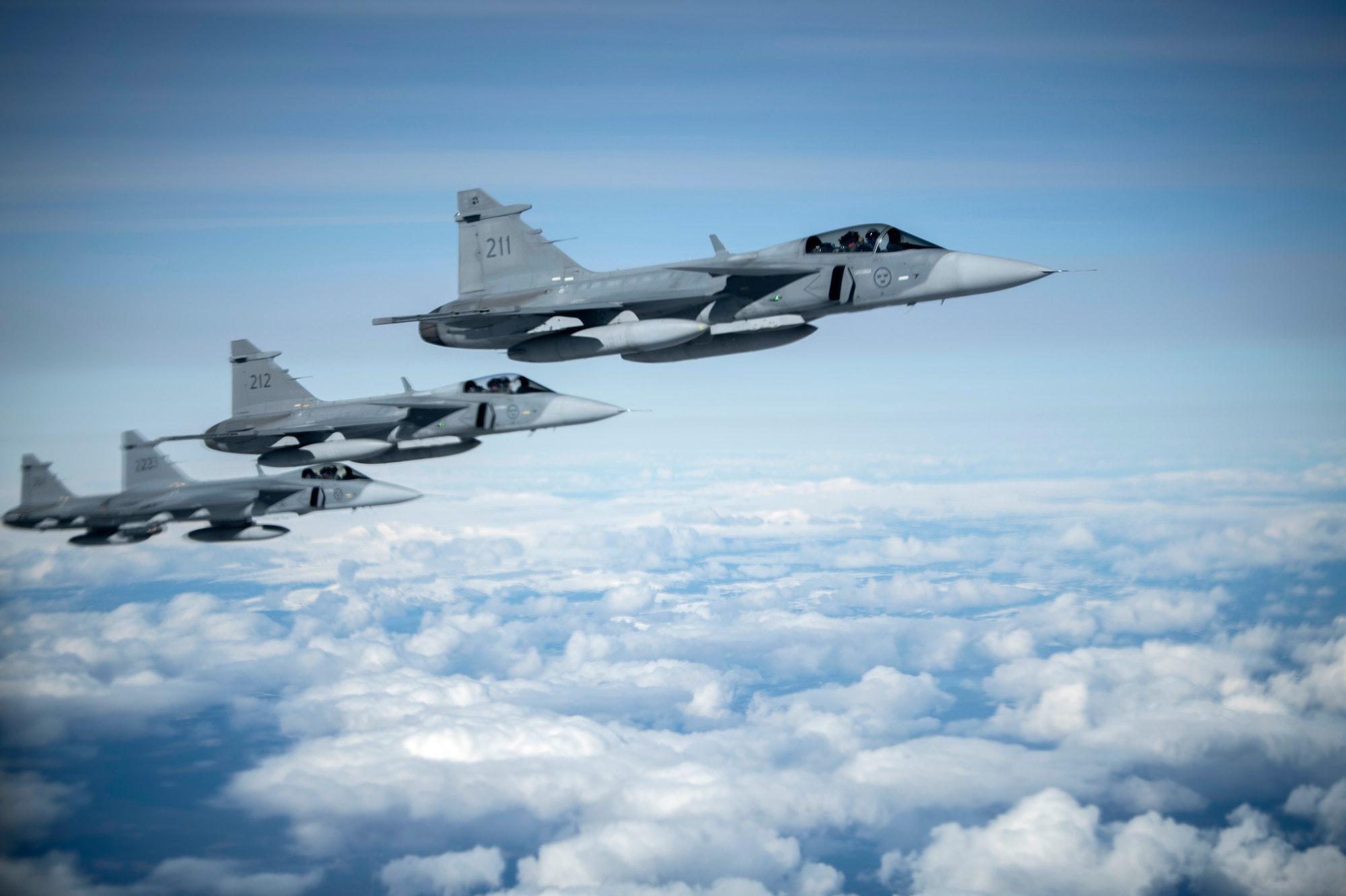 Swedish Armed Forces Gripens fly in formation during a Bomber Task Force Europe mission over Sweden, May 20, 2020. Training with our NATO allies and theater partner nations contributes to enhanced resiliency and interoperability and enables us to build enduring relationships necessary to confront the broad range of global challenges. (U.S. Air Force photo by Tech. Sgt. Emerson Nuñez)