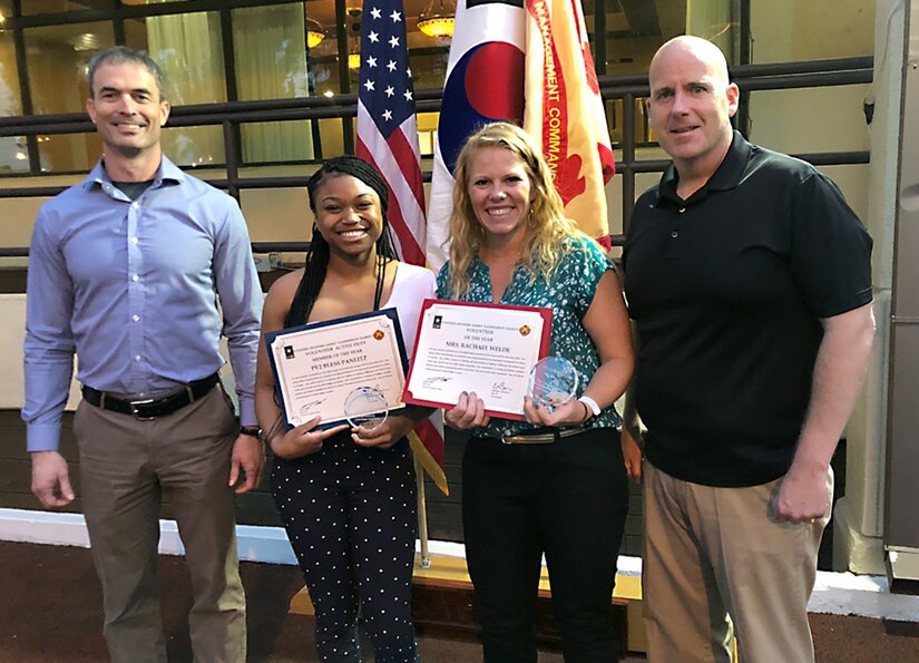 U.S. Army Pfc. Bless Pantlitz, center left, a member of the 563rd Medical Logistics Company, and Rachael Welde, center right, are pictured with USAG-Daegu Commander Col. Ed Ballanco and Command Sgt. Maj. Alan Cline on May 14 at Camp Walker's Evergreen Club. Pantlitz was recently recognized as USAG-Daegu's Active Duty Service Member of the Year and Welde was named the overall USFK Area IV and USAG-Daegu Volunteer of the Year, along with the President’s Volunteer Service Award.