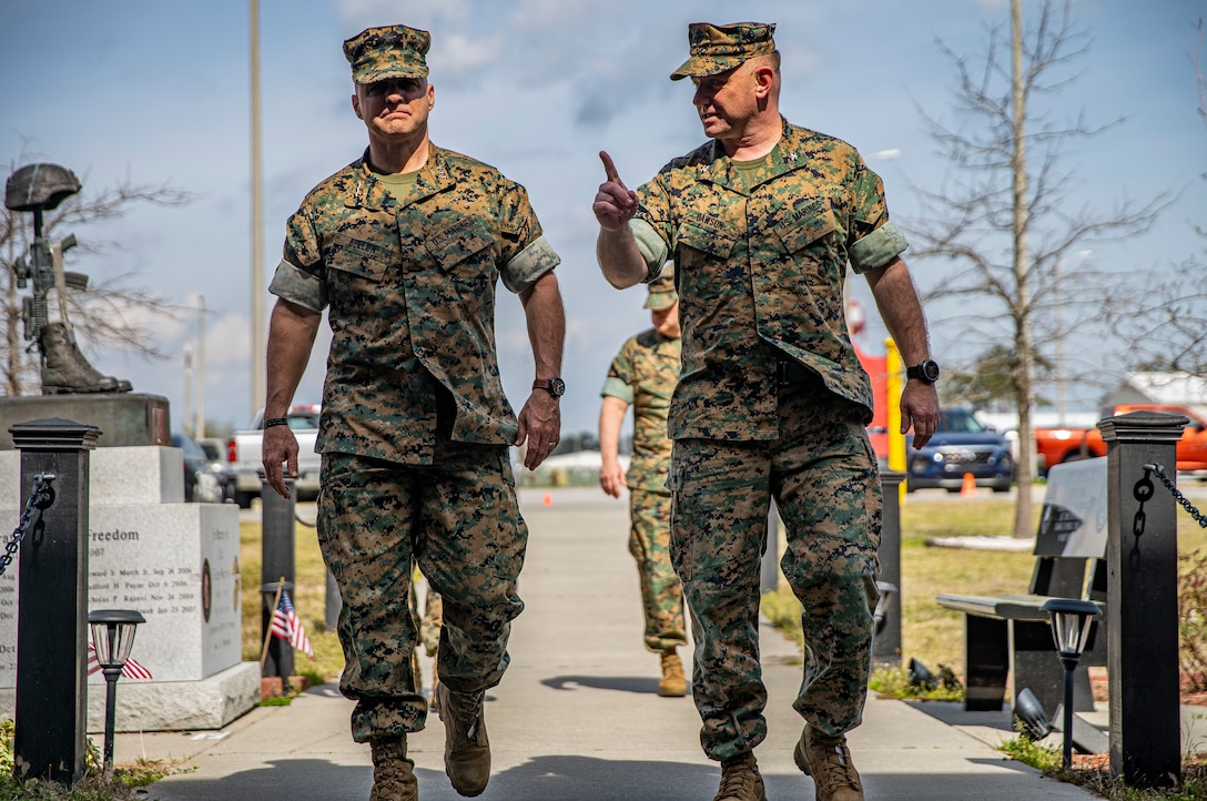 Lt. Gen. David G. Bellon, commander of Marine Forces Reserve and Marine Forces North, left, and Col. Vincent C. Dawson, commanding officer of Special Purpose Marine Air-Ground Task Force - Southern Command, tour the SPMAGTF-SC working facilities on Marine Corps Base Camp Lejeune, North Carolina, March 11, 2020. During the visit, Lt. Gen. Bellon greeted the Marines at their respective work areas and presented challenge coins to two Marines for their hard work preparing for the mobilization of the task force. Lt. Gen. Bellon shared his professional guidance and mentorship with the SPMAGTF-SC 20 Marines and Sailors from his experience working in Southern Command’s area of operations. The SPMAGTF are conducting a variety of pre-deployment training events and qualifications in order to enhance crisis response readiness for the Latin American and Caribbean region. (U.S. Marine Corps photo by Sgt. Andy O. Martinez)