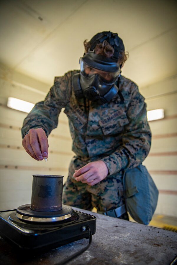 Pfc. Luke Kramer, a chemical, biological, radiological, nuclear defense specialist with 2nd Light Armored Reconnaissance Battalion breaks apart a CS gas capsule during gas chamber training at Marine Corps Base Camp Lejeune, North Carolina, March 16, 2020. Marines and Sailors with SPMAGTF-SC are conducting a variety of pre-deployment training events and qualifications in order to enhance crisis response preparedness in and around Latin America and the Caribbean. These events assist the Marines and Sailors with providing security cooperation training and engineering projects alongside partner nation military forces in Central and South America. Kramer is from Manteca, California.  (U.S. Marine Corps photo by Sgt. Andy O. Martinez)