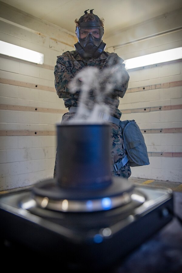 Pfc. Luke Kramer, a chemical, biological, radiological, nuclear defense specialist with 2nd Light Armored Reconnaissance Battalion waits for the CS gas to spread across the chamber during gas chamber training at Marine Corps Base Camp Lejeune, North Carolina, March 16, 2020. The Marines and Sailors with SPMAGTF-SC are conducting a variety of pre-deployment training events and qualifications in order to enhance crisis response preparedness in and around Latin America and the Caribbean. These events assist the Marines and Sailors with providing security cooperation training and engineering projects alongside partner nation military forces in Central and South America. Kramer is a native of Manteca, California. (U.S. Marine Corps photo by Sgt. Andy O. Martinez)