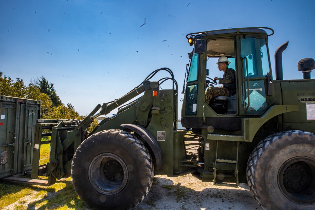 Lance Cpl. Ismael Renteria, a heavy equipment operator with Special Purpose Marine Air-Ground Task Force - Southern Command, operates a TRAM 624KR Tractor during a command post exercise at Camp Lejeune, North Carolina, April 6, 2020. The CPX increases readiness and challenges SPMAGTF-SC command and control, communications and timely decision-making capabilities through simulated real-world scenarios. SPMAGTF-SC will be deployed into the Southern Command area of operation to provide crisis response preparedness efforts, security cooperation training and engineering events to help strengthen relations with partner nations throughout Central and South America. Renteria is a native of Atwater, California. (U.S. Marine Corps photo by Sgt. Andy O. Martinez)