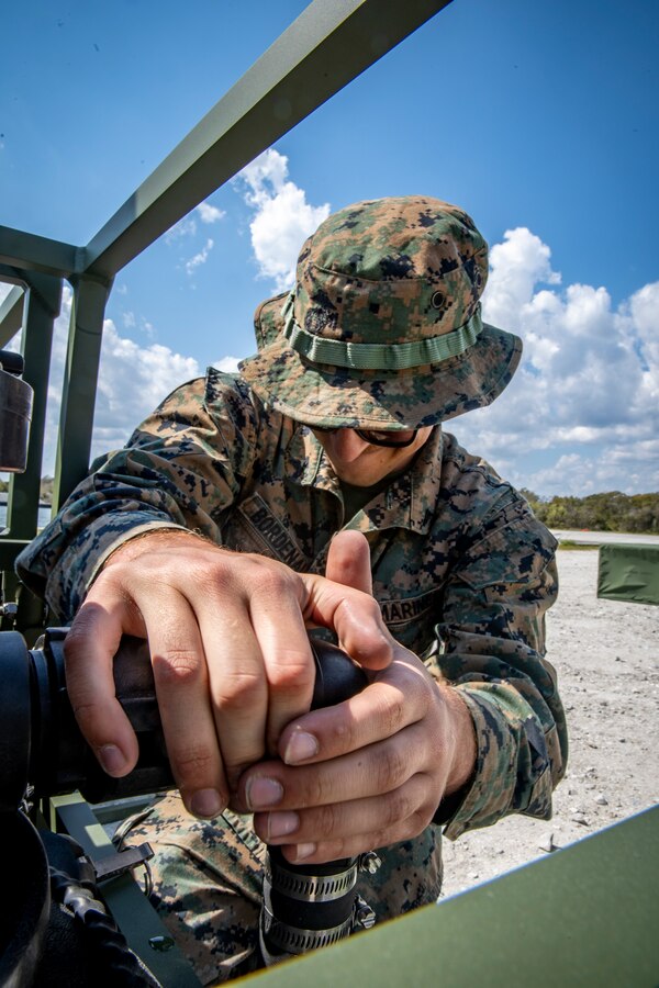 Lance Cpl. Daniel Bordenave, a water support technician with Special Purpose Marine Air-Ground Task Force - Southern Command, sets up a reverse osmosis module during a command post exercise at Camp Lejeune, North Carolina, April 6, 2020. The CPX increases readiness and challenges SPMAGTF-SC command and control, communications and timely decision-making capabilities through simulated real-world scenarios. SPMAGTF-SC will be deployed into the Southern Command area of operation to provide crisis response preparedness efforts, security cooperation training and engineering events to help strengthen relations with partner nations throughout Central and South America. Bordenave is a native of Pleasanton, California. (U.S. Marine Corps photo by Sgt. Andy O. Martinez)