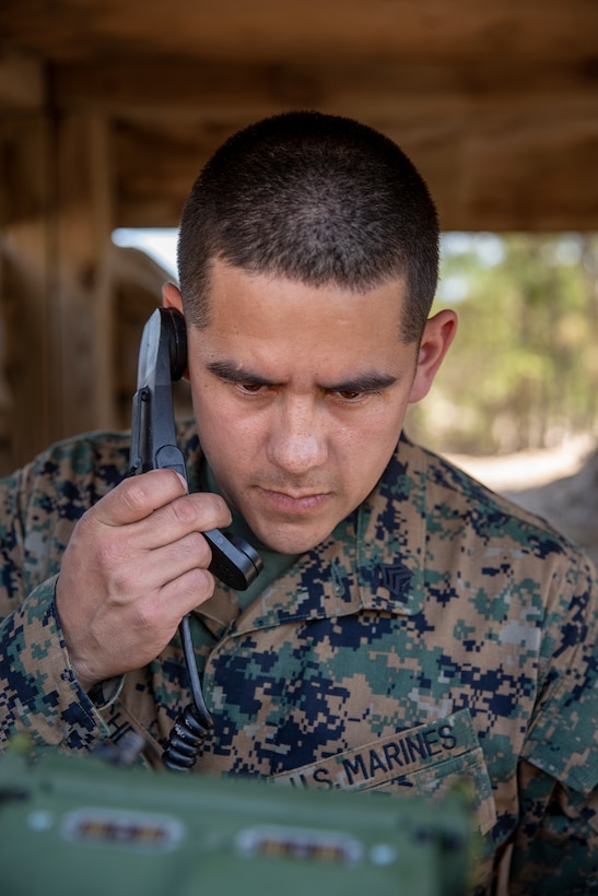 Sgt. Raul Sanchez, a radio operator with Special Purpose Marine Air-Ground Task Force - Southern Command, establishes radio communications during a command post exercise at Marine Corps Base Camp Lejeune, North Carolina, April 7, 2020. The Marines and Sailors of SPMAGTF-SC use the training opportunity of the CPX to both show their capabilities in a controlled environment and prepare for the upcoming mission. SPMAGTF-SC is poised to conduct crisis response, theater security cooperation, and general engineering training alongside partner nation militaries in Latin America and the Caribbean. Sanchez is a native of Burlington, Washington. (U.S. Marine Corps photo by Cpl. Benjamin D. Larsen)