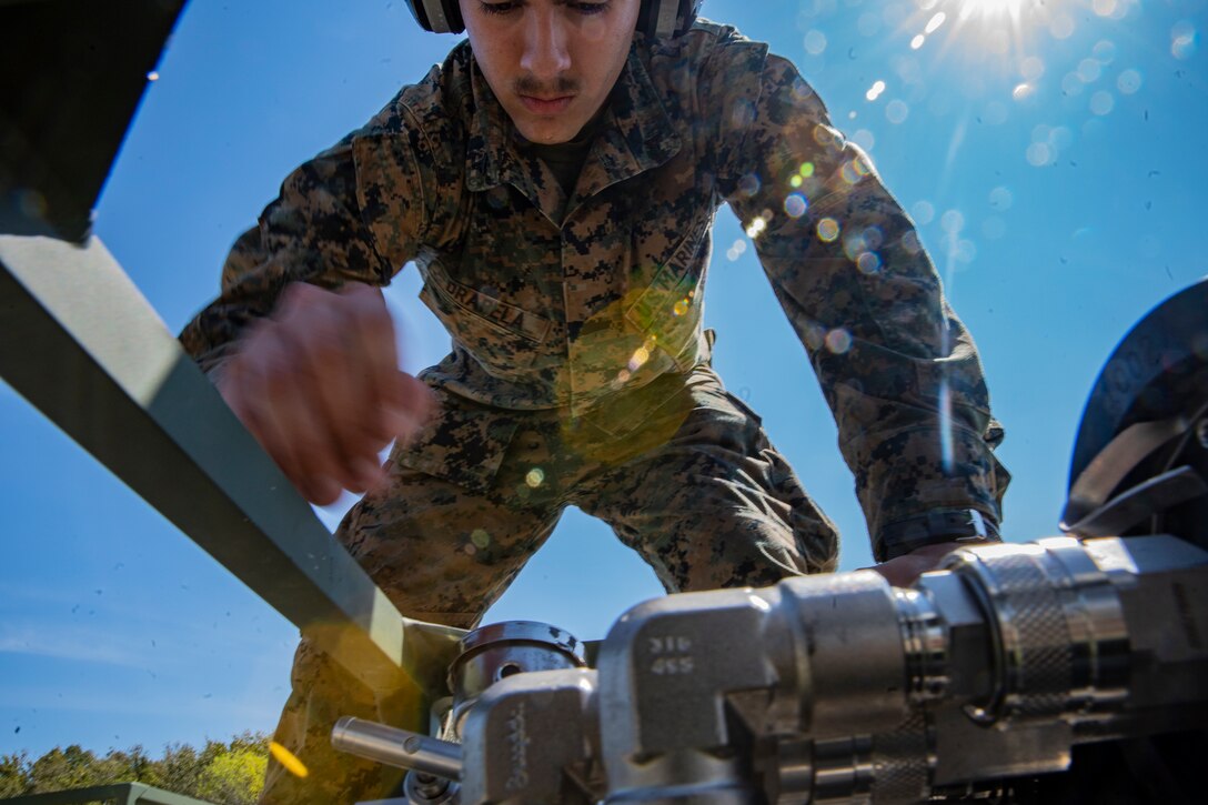 Lance Cpl. Brandon Drapela, a water support technician with Special Purpose Marine Air-Ground Task Force - Southern Command, sets up a reverse osmosis module during a command post exercise at Camp Lejeune, North Carolina, April 7, 2020. The CPX increases readiness and challenges SPMAGTF-SC command and control, communications and timely decision-making capabilities through simulated real-world scenarios. SPMAGTF-SC will be deployed into the Southern Command area of operation to provide crisis response preparedness efforts, security cooperation training and engineering events to help strengthen relations with partner nations throughout Central and South America. Drapela is a native of Corvallis, Oregon. (U.S. Marine Corps photo by Sgt. Andy O. Martinez)
