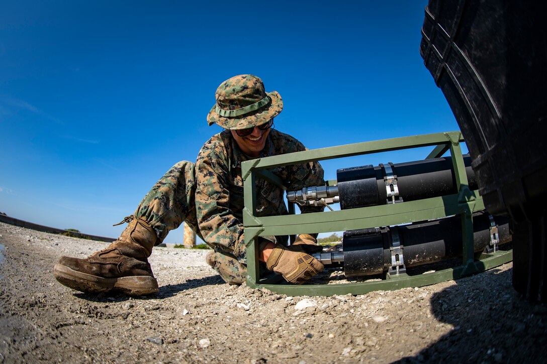 Lance Cpl. Daniel Bordenave, a water support technician with Special Purpose Marine Air-Ground Task Force - Southern Command, sets up a lightweight water purification system during a command post exercise at Camp Lejeune, North Carolina, April 8, 2020. Water support technician Marines used lightweight water purification systems to purify water before providing it to the combat engineer Marines working at another site. The CPX increases readiness and challenges SPMAGTF-SC command and control, communications and timely decision-making capabilities through simulated real-world scenarios. SPMAGTF-SC will be deployed into the Southern Command area of operation to provide crisis response preparedness efforts, security cooperation training and engineering events to help strengthen relations with partner nations throughout Central and South America. Bordenave is from Pleasanton, California. (U.S. Marine Corps photo by Sgt. Andy O. Martinez)