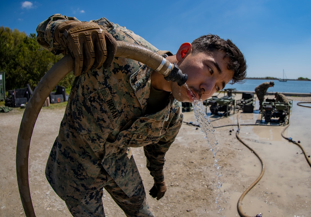 Lance Cpl. Anthony Bryan, a water support technician with Special Purpose Marine Air-Ground Task Force - Southern Command, reviews recently purified water’s chlorine level during the command post exercise at Camp Lejeune, North Carolina, April 8, 2020. Water support technician Marines used lightweight water purification systems to purify water before providing it to the combat engineer Marines working at another site. The CPX increases readiness and challenges SPMAGTF-SC command and control, communications and timely decision-making capabilities through simulated real-world scenarios. SPMAGTF-SC will be deployed into the Southern Command area of operation to provide crisis response preparedness efforts, security cooperation training and engineering events to help strengthen relations with partner nations throughout Central and South America. Bryan is a native of Eugene, Oregon. (U.S. Marine Corps photo by Sgt. Andy O. Martinez)