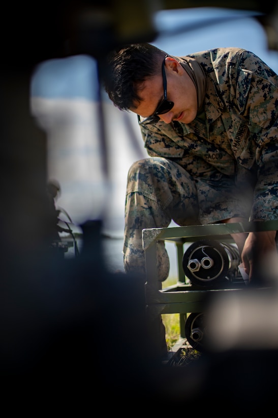 Lance Cpl. Joseph Sacco, a water support technician with Special Purpose Marine Air-Ground Task Force - Southern Command, sets up a lightweight water purification system during a command post exercise at Camp Lejeune, North Carolina, April 10, 2020. Water support technician Marines used lightweight water purification systems to purify water before providing it to the combat engineer Marines working at another site. The CPX increases readiness and challenges SPMAGTF-SC command and control, communications and timely decision-making capabilities through simulated real-world scenarios. SPMAGTF-SC will be deployed into the Southern Command area of operation to provide crisis response preparedness efforts, security cooperation training and engineering events to help strengthen relations with partner nations throughout Central and South America. Sacco is a native of Beaverton, Oregon. (U.S. Marine Corps photo by Sgt. Andy O. Martinez)