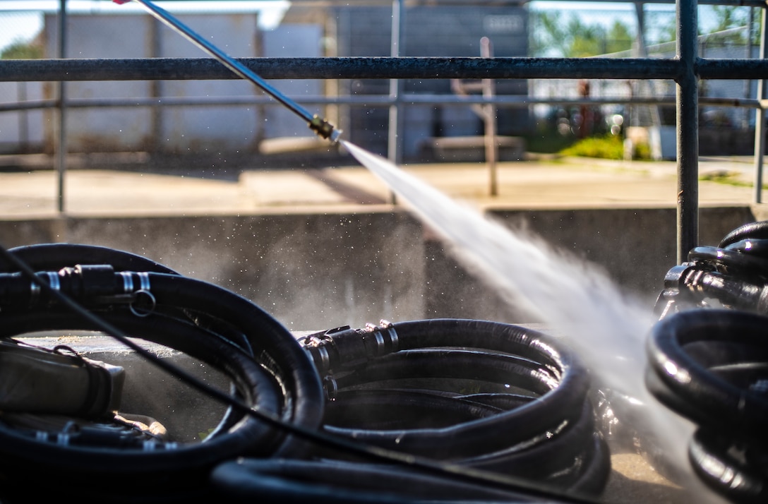 Marines with Special Purpose Marine Air-Ground Task Force - Southern Command conduct an equipment wash down during a general exercise at Camp Lejeune, North Carolina, April 14, 2020. The Marines removed dirt and debris from equipment to help minimize the risk of agricultural contamination before putting it into storage for future use. The GENEX includes training events such as engineering projects and evacuation control center training scenarios that will help build the SPMAGTF-SC for their final certification exercise. These training events also provide the Marines and Sailors with real-world scenarios to prepare them for their deployment to assist partner nation militaries in Latin America and the Caribbean. (U.S. Marine Corps photo by Sgt. Andy O. Martinez)