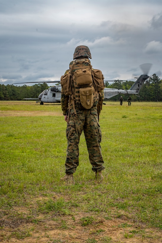 Sgt. Coleman Hyerstay, an engineer platoon sergeant with Special Purpose Marine Air-Ground Task Force - Southern Command, waits to board a CH-53E Super Stallion helicopter for evacuation control center training during a general exercise at Camp Lejeune, North Carolina, April 15, 2020. The GENEX includes training events such as engineering projects and evacuation control center training scenarios that will help build the SPMAGTF-SC for their final certification exercise. These training events also provide the Marines and Sailors with real-world scenarios to prepare them for their deployment to assist partner nation militaries in Latin America and the Caribbean. Hyerstay is a native of Eugene, Oregon. (U.S. Marine Corps photo by Sgt. Andy O. Martinez)