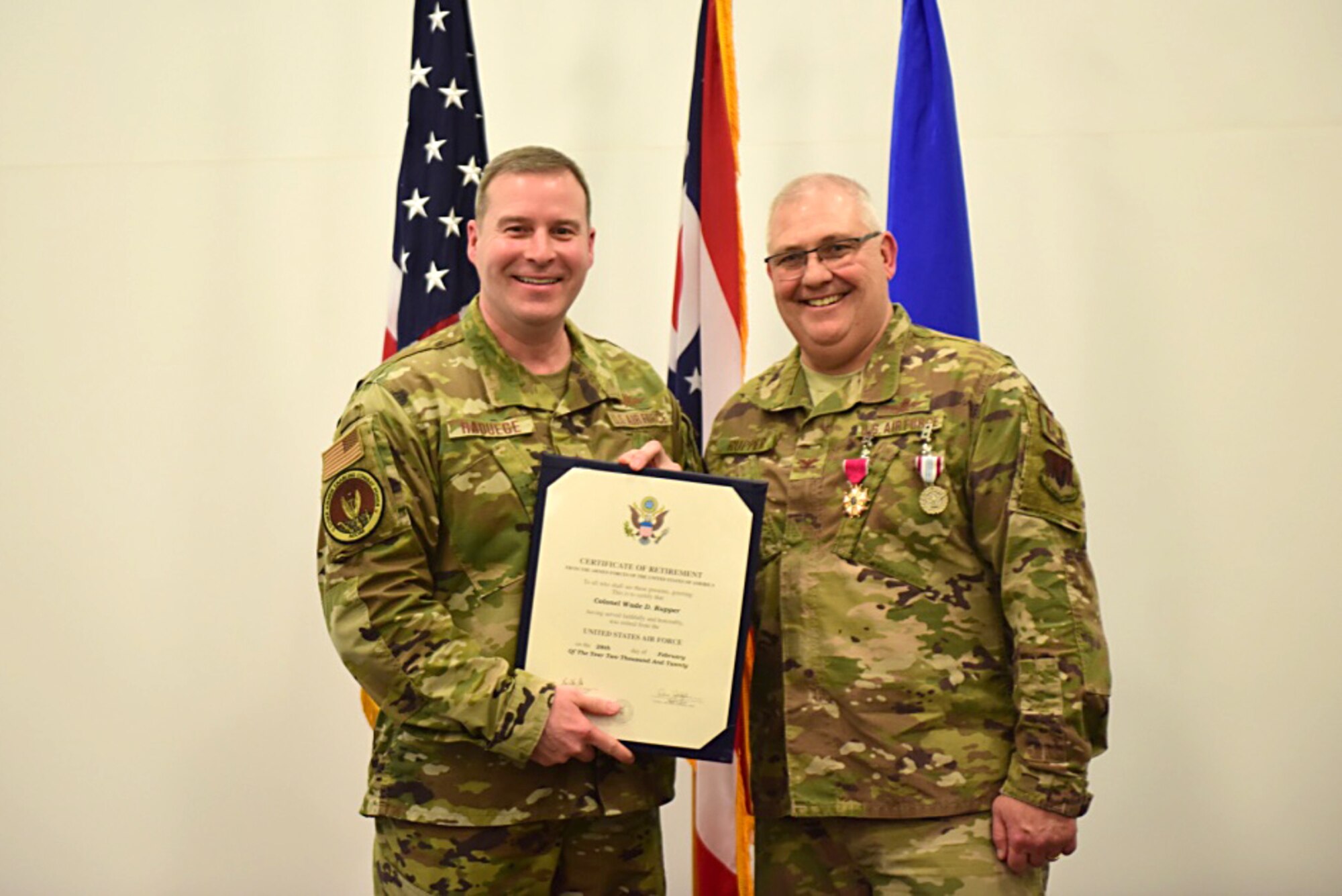Col. Wade Rupper, the outgoing commander of the 251st Cyberspace Engineering Installation Group, receives his certificate of retirement Jan. 11, 2020 at his retirement ceremony in Springfield, Ohio. Rupper retired from the Ohio Air National Guard after 36 years of service. (U.S. Air National Guard photo by Staff. Sgt. Rachel Simones)