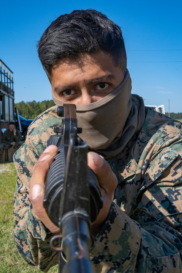 Lance Cpl. Luis Gonzaleznieto, a combat engineer with Special Purpose Marine Air-Ground Task Force - Southern Command, participates in military operations on urban terrain training during a general exercise at Camp Lejeune, North Carolina, April 17, 2020. MOUT training helps Marines develop small unit leadership and maintain operational readiness. The GENEX includes training events such as engineering projects and evacuation control center training scenarios that will help build the SPMAGTF-SC for their final certification exercise. These training events also provide the Marines and Sailors with real-world scenarios to prepare them for their deployment to assist partner nation militaries in Latin America and the Caribbean. Gonzaleznieto is a native of Portland, Oregon. (U.S. Marine Corps photo by Sgt. Andy O. Martinez)