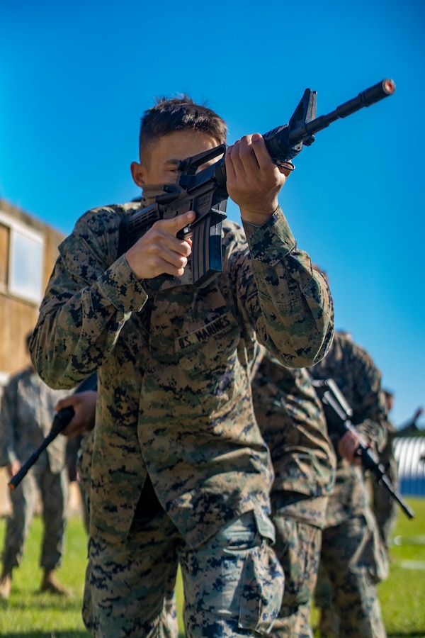 Cpl. Andrew McDonald, a combat engineer with Special Purpose Marine Air-Ground Task Force - Southern Command, sights in with a rubber, dummy rifle as he participates in military operations on urban terrain training during a general exercise at Camp Lejeune, North Carolina, April 17, 2020. MOUT training helps Marines develop small unit leadership and maintain operational readiness. The GENEX includes training events such as engineering projects and evacuation control center training scenarios that will help build the SPMAGTF-SC for their final certification exercise. These training events also provide the Marines and Sailors with real-world scenarios to prepare them for their deployment to assist partner nation militaries in Latin America and the Caribbean. McDonald is a native of Dallas, Oregon. (U.S. Marine Corps photo by Sgt. Andy O. Martinez)
