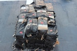 Bales of cocaine are shown aboard the Coast Guard Cutter Active.
