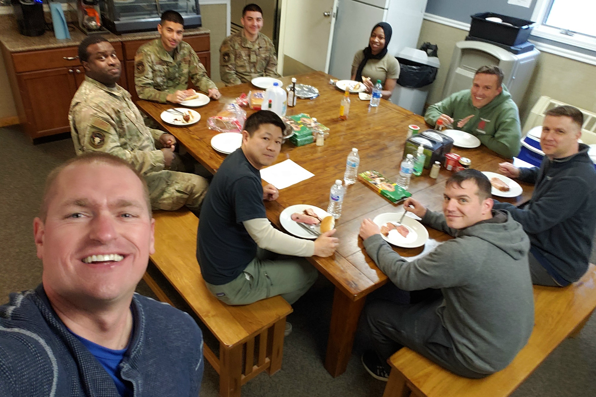 Capt. Bill Mesaeh, a 341st Missile Wing chaplain, takes a photo with Airmen at a Missile Alert Facility May 12, 2020, near Malmstrom Air Force Base, Montana.