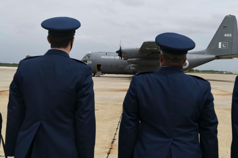 U.S. Air Force leadership await as a Pakistan air force C-130 completes its taxi at Joint Base Andrews, Md., May 21, 2020. Brig. Gen. Matthew C. Isler, Director of Regional Affairs for the Deputy Under Secretary of the Air Force, International Affairs, came to Joint Base Andrews to thank the Pakistani representatives for their support. (U.S. Air Force photo by Airman 1st Class Spencer Slocum)