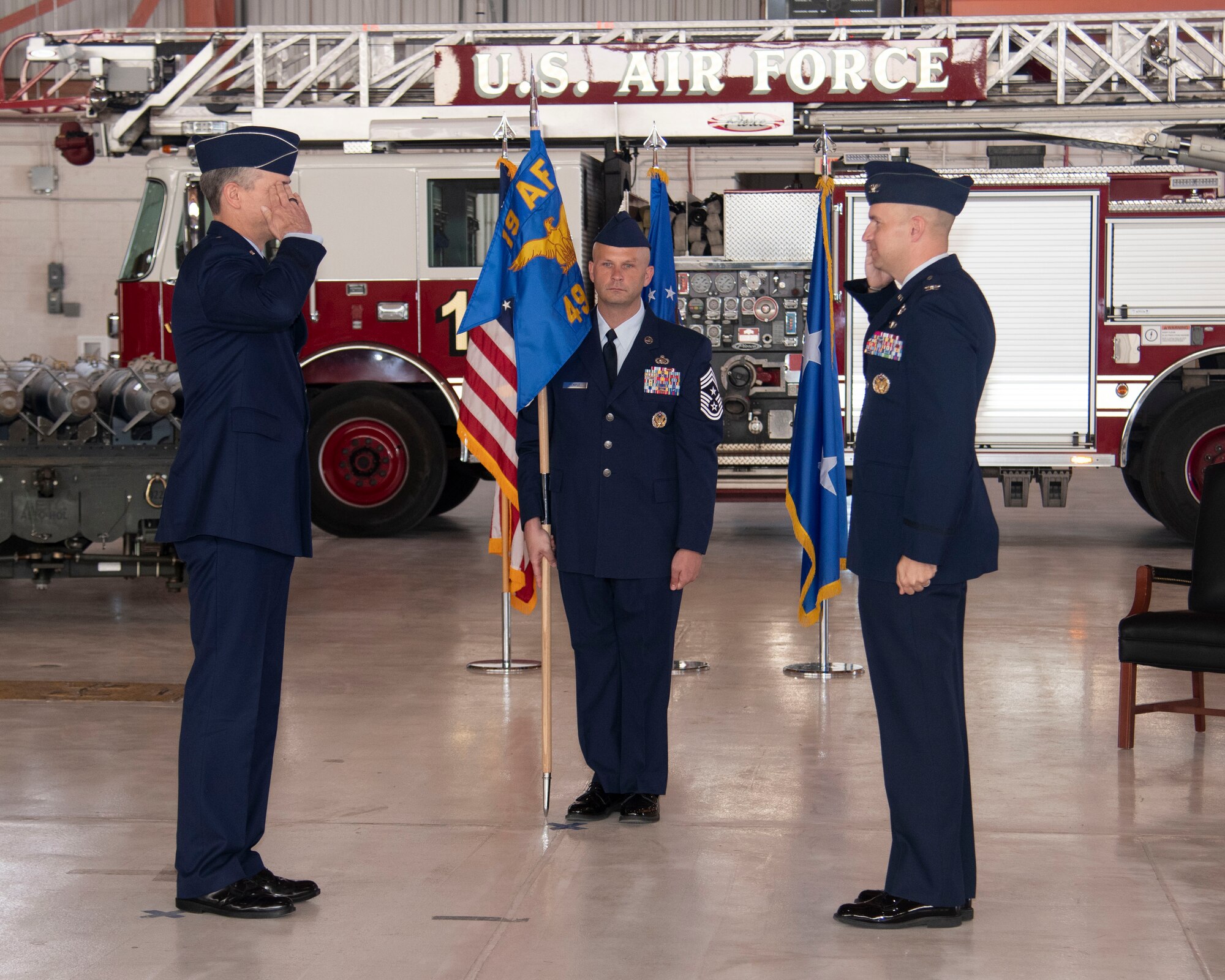 Col. Ryan Keeney (right), 49th Wing commander, assumes command from Maj. Gen. Craig Wills (left), 19th Air Force commander, during the 49th WG Change of Command ceremony, May 21, 2020, on Holloman Air Force Base, N.M. Keeney previously served as the Air Education and Training Command Operations and Communications deputy director at Joint Base San Antonio-Randolph, Texas. (U.S. Air Force photo by Tech. Sgt. BreeAnn Sachs)