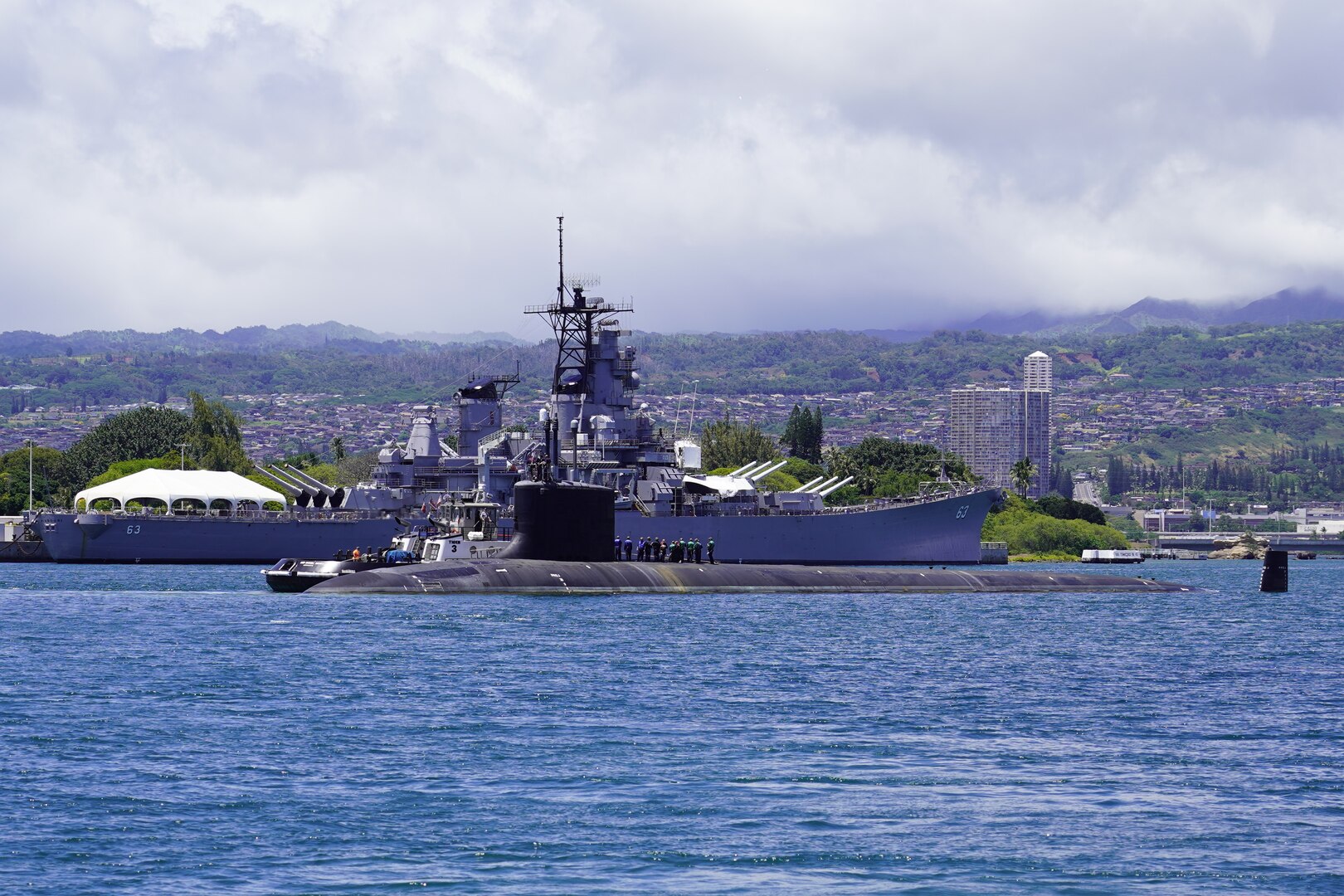 PEARL HARBOR, Hawaii (May 10, 2020) – USS Missouri (SSN 780), a Virginia-class fast-attack submarine, passes the historic battleship Missouri (BB-63) before departing for sea trials on May 10.  Missouri's routine maintenance and modernization work was completed five days ahead of schedule after successful sea trials and certification. The submarine's recent availability at Pearl Harbor Naval Shipyard and Intermediate Maintenance Facility required 2.2 million work-hours to complete more than 20,000 jobs that will ensure the ship remains fully operational for its planned 33-year service life.