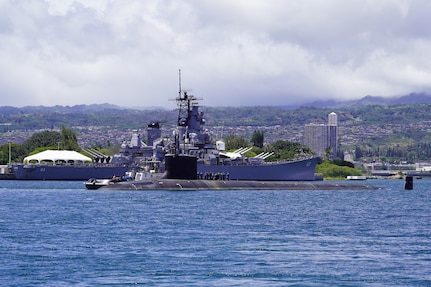 PEARL HARBOR, Hawaii (May 10, 2020) – USS Missouri (SSN 780), a Virginia-class fast-attack submarine, passes the historic battleship Missouri (BB-63) before departing for sea trials on May 10.  Missouri's routine maintenance and modernization work was completed five days ahead of schedule after successful sea trials and certification. The submarine's recent availability at Pearl Harbor Naval Shipyard and Intermediate Maintenance Facility required 2.2 million work-hours to complete more than 20,000 jobs that will ensure the ship remains fully operational for its planned 33-year service life.