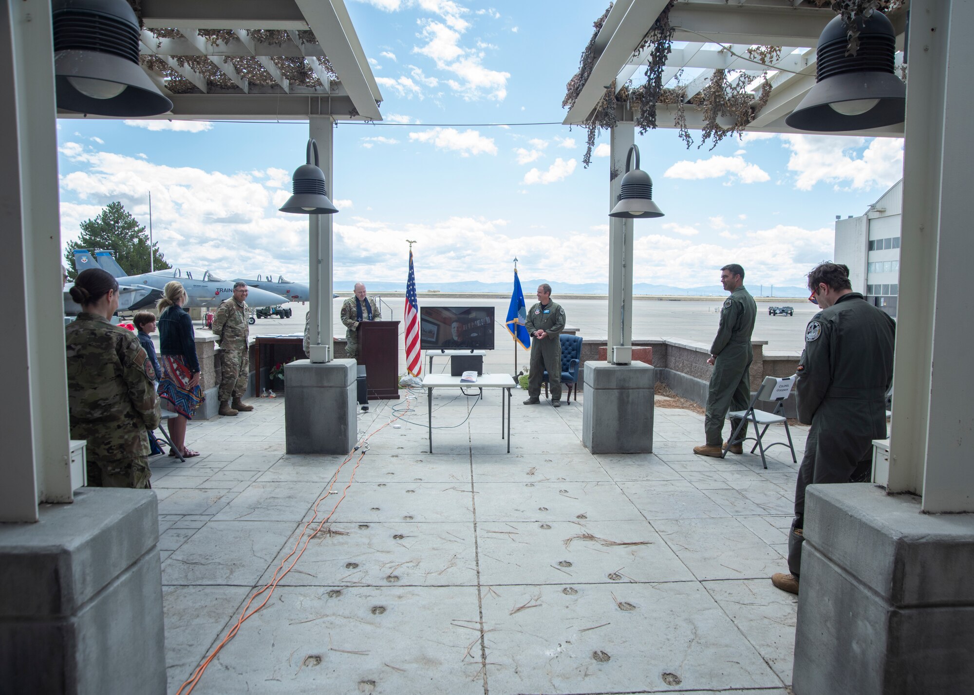 Family, friends and coworkers participate in Lt. Col. Aaron C. “Badger” Lapp retirement ceremony, May 15, 2020, on Mountain Home Air Force Base, Idaho. Lapp has served the Air Force for 20 years and one month and has over 3,000 flight hours and 900 Combat hours. (U.S. Air Force photo by Airman 1st Class Akeem K. Campbell)