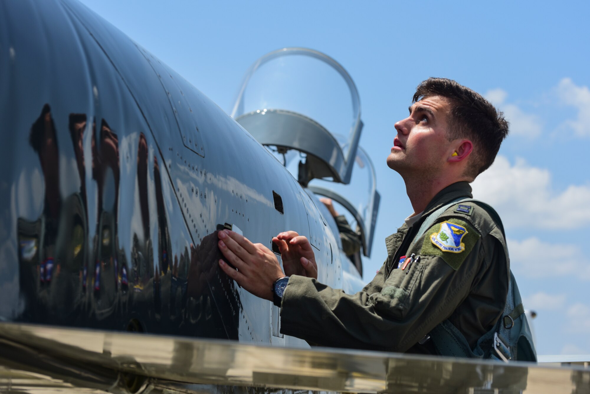 Capt. Mark Palyok, 87th Flying Training Squadron assistant flight commander, inspects a T-38C Talon as preparation to depart from Laughlin Air Force Base, Texas, to fly in a dissimilar formation of aircraft--one over Del Rio and Eagle Pass and the other over San Angelo--on May 21, 2020. The flyover consisted of the T-6A Texan II, T-1A Jayhawk and the T-38 and honored the men and women on the front lines of the fight against COVID-19 during the Defense Department’s #AmericaStrong salute. (U.S. Air Force photo by Senior Airman Anne McCready)