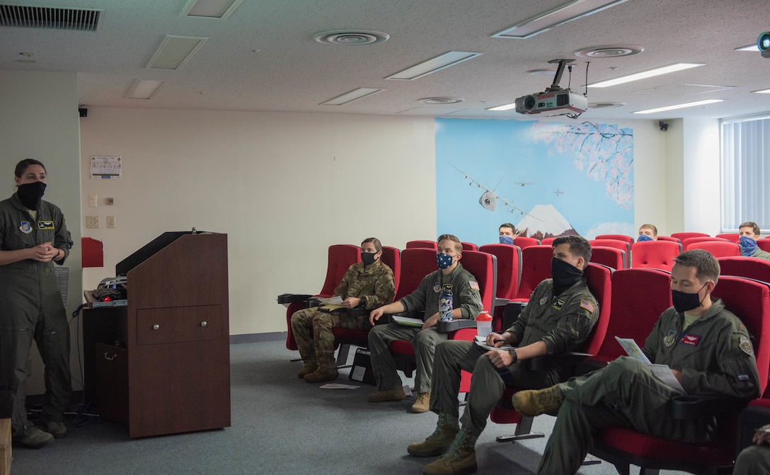 Aircrews conduct a physically distant pre-flight briefing before stepping out to their aircraft as part of the 374th Airlift Wing’s Samurai Surge training exercise.