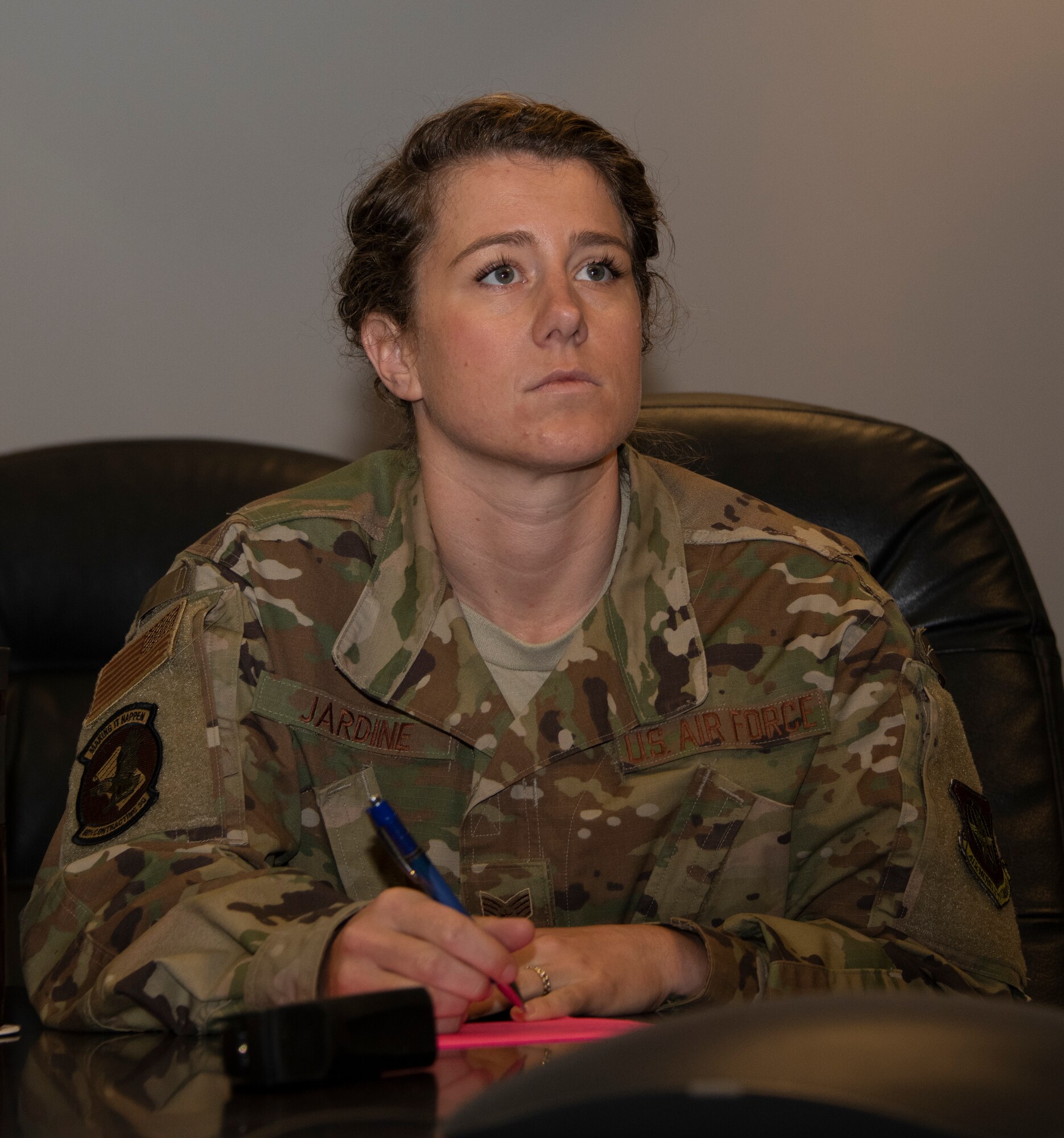 U.S. Air Force Staff Sgt. Amanda Jardine, 60th Contracting Squadron contracting officer, listens to a presentation May 20, 2020, during a commercial solutions opening event at Travis Air Force Base, California. The event, the first of its kind in Travis AFB history, was organized by the Travis Phoenix Spark Innovation Cell and the 60th CONS. (U.S. Air Force photo by Tech. Sgt. James Hodgman)