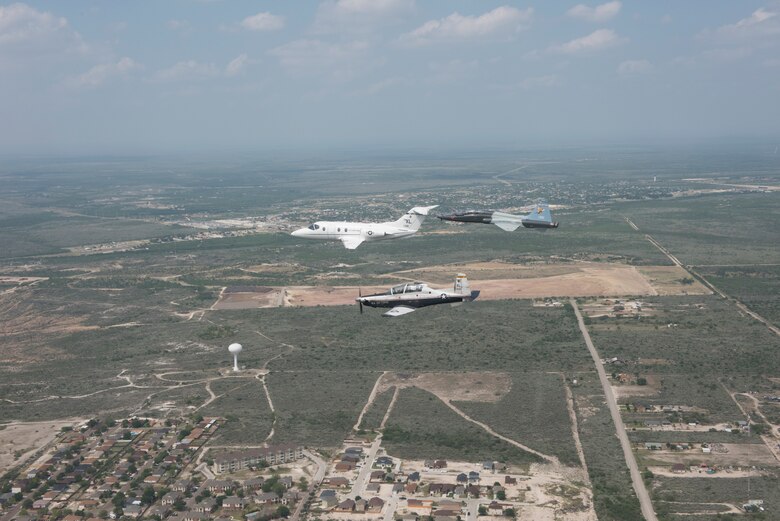 T-6 Texan II, T-1A Jayhawk and a T-38C Talon, assigned to Laughlin Air Force Base, Texas, perform a flyover in Del Rio, Texas, May 21, 2020. Laughlin performed flyovers in three Texas cities as a part of the America Strong America Salutes Campaign, to show its gratitude for all front-line responders, economy sustainers and community members in the COVID-19 pandemic. (U.S. Air Force photo by Master Sgt. JT May III)