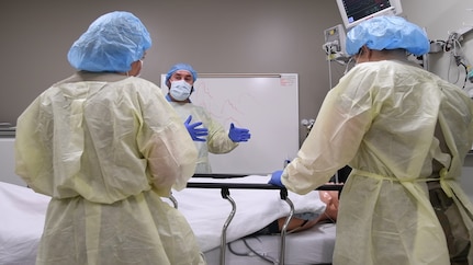 Warrior medics from the San Antonio Military Health System perform simulated medical procedures on mannequins as part of a training exercise May 21, 2020 at Wilford Hall Ambulatory Surgical Center, Joint Base San Antonio-Lackland, Texas. (U.S. Air Force photo by Senior Airman Ryan Mancuso)